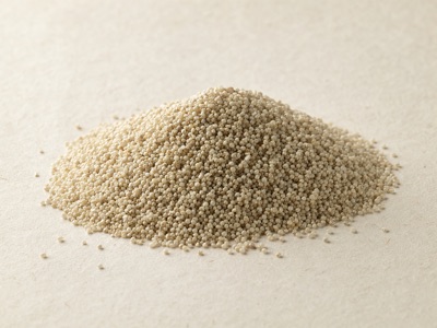A heap of dehulled little millet grain, very fine pale cream kernels